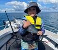 Evan Reader was chuffed with this Hervey Bay mac tuna. Well done young fella